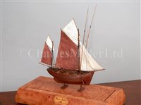Lot 280 - AN UNUSUAL MINIATURE GOLD-COVERED PRISONER-OF-WAR TYPE MODEL OF A 74-GUN SHIP