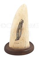 Lot 147 - Ø AN EARLY 20TH-CENTURY INUIT CARVED WHALE'S TOOTH
