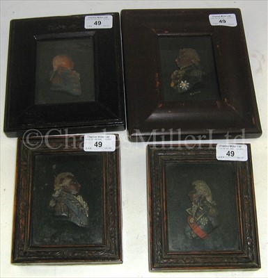 Lot 49 - A SET OF FOUR POLYCHROME WAX PROFILES OF...
