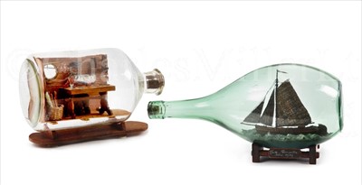 Lot 131 - A BOTTLED DIORAMA<br/>depicting a sailor sitting...
