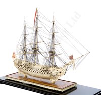 Lot 261 - A LARGE, FINELY CARVED AND WELL PRESENTED EARLY 19TH CENTURY NAPOLEONIC FRENCH PRISONER OF WAR BONE SHIP MODEL FOR A FIRST RATE SHIP OF THE LINE TRADITIONALLY IDENTIFIED AS H.M.S. CALEDONIA