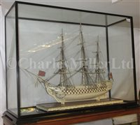Lot 261 - A LARGE, FINELY CARVED AND WELL PRESENTED EARLY 19TH CENTURY NAPOLEONIC FRENCH PRISONER OF WAR BONE SHIP MODEL FOR A FIRST RATE SHIP OF THE LINE TRADITIONALLY IDENTIFIED AS H.M.S. CALEDONIA