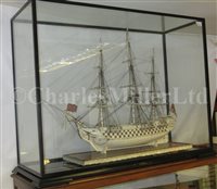 Lot 261 - A LARGE, FINELY CARVED AND WELL PRESENTED EARLY 19TH CENTURY NAPOLEONIC FRENCH PRISONER OF WAR BONE SHIP MODEL FOR A FIRST RATE SHIP OF THE LINE TRADITIONALLY IDENTIFIED AS H.M.S. CALEDONIA