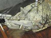 Lot 261 - A LARGE, FINELY CARVED AND WELL PRESENTED EARLY 19TH CENTURY NAPOLEONIC FRENCH PRISONER OF WAR BONE SHIP MODEL FOR A FIRST RATE SHIP OF THE LINE TRADITIONALLY IDENTIFIED AS H.M.S. CALEDONIA