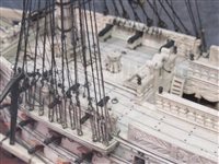 Lot 261 - A LARGE, FINELY CARVED AND WELL PRESENTED EARLY 19TH CENTURY NAPOLEONIC FRENCH PRISONER OF WAR BONE SHIP MODEL FOR A FIRST RATE SHIP OF THE LINE TRADITIONALLY IDENTIFIED AS H.M.S. CALEDONIA