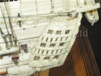 Lot 261 - A LARGE, FINELY CARVED AND WELL PRESENTED EARLY 19TH CENTURY NAPOLEONIC FRENCH PRISONER OF WAR BONE SHIP MODEL FOR A FIRST RATE SHIP OF THE LINE TRADITIONALLY IDENTIFIED AS H.M.S. CALEDONIA