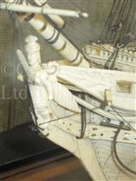 Lot 261 - A LARGE, FINELY CARVED AND WELL PRESENTED EARLY 19TH CENTURY NAPOLEONIC FRENCH PRISONER OF WAR BONE SHIP MODEL FOR A FIRST RATE SHIP OF THE LINE TRADITIONALLY IDENTIFIED AS H.M.S. CALEDONIA