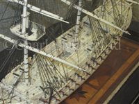Lot 261 - A LARGE, FINELY CARVED AND WELL PRESENTED EARLY 19TH CENTURY NAPOLEONIC FRENCH PRISONER OF WAR BONE SHIP MODEL FOR A FIRST RATE SHIP OF THE LINE TRADITIONALLY IDENTIFIED AS H.M.S. CALEDONIA