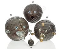 Lot 70 - A SAILORWORK CARVED COCONUT BUGBEAR POWER FLASK, FIRST HALF 19TH CENTURY