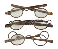 Lot 188 - A PAIR OF EARLY 19TH CENTURY DOUBLE FOLDING TINTED SILVER SPECTACLES; and two others