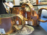 Lot 36 - A SET OF GEORGE VI COPPER GROG MEASURES