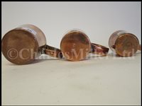 Lot 36 - A SET OF GEORGE VI COPPER GROG MEASURES
