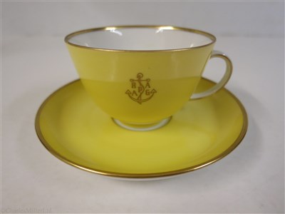 Lot 56 - HAMBURG-AMERICAN (H.A.P.A.G.) LINE: A YELLOW PORCELAIN COFFEE CUP AND SAUCER BY FÜRSTENBERG, GERMANY, CIRCA 1950