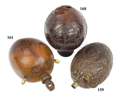 Lot 160 - AN EARLY 19TH CENTURY CARVED COCONUT BUGBEAR