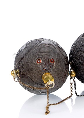 Lot 29 - A FINELY CARVED COCONUT BUGBEAR FLASK, FIRST QUARTER 19TH CENTURY