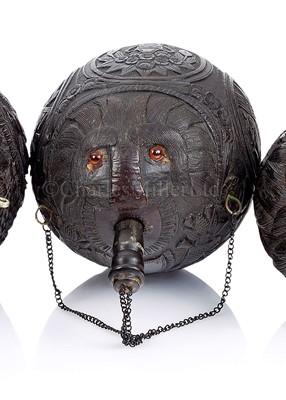 Lot 32 - A 19TH CENTURY CARVED COCONUT BUGBEAR