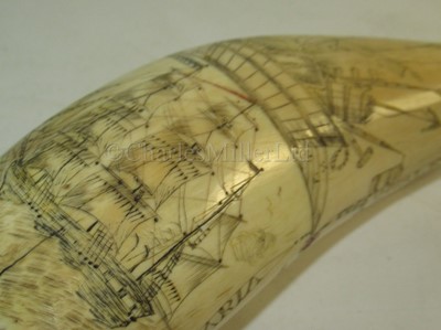 Lot 121 - Ø AN UNUSUAL SCRIMSHAW DECORATED WHALE'S TOOTH