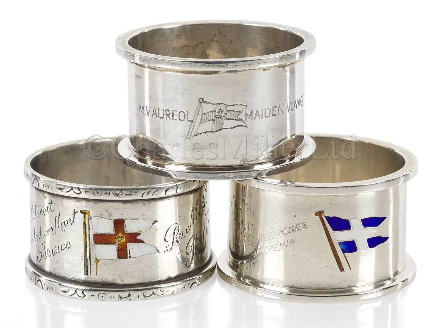 Lot 155 - THREE SOUVENIR ENAMEL AND SILVER NAPKIN RINGS