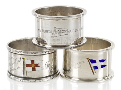 Lot 155 - THREE SOUVENIR ENAMEL AND SILVER NAPKIN RINGS
