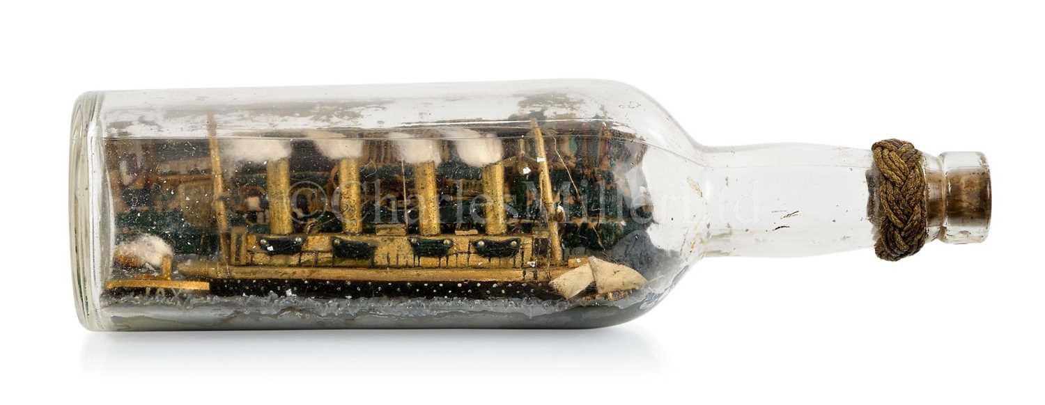 Lot 79 - A COMMEMORATIVE SHIP IN BOTTLE MODEL OF R.M.S. LUSITANIA MADE BY A SURVIVOR, 1915