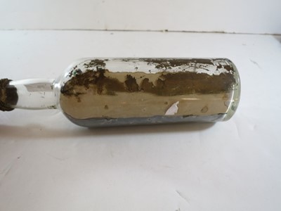 Lot 79 - A COMMEMORATIVE SHIP IN BOTTLE MODEL OF R.M.S. LUSITANIA MADE BY A SURVIVOR, 1915
