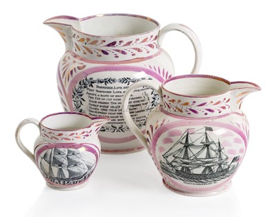 Lot 157 - A GRADUATING SET OF THREE SUNDERLAND LUSTREWARE POTTERY JUGS