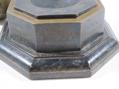 Lot 144 - A 1905 TRAFALGAR CENTENARY CANNON BALL AND STAND COMMEMORATING H.M.S. VICTORY'S BATTLES