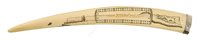 Lot 130 - Ø A LARGE INUIT SCRIMSHAW DECORATED CRIBBAGE BOARD WALRUS TUSK, CIRCA 1910