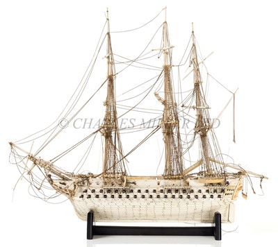 Lot 143 - AN EARLY 19TH CENTURY FRENCH NAPOLEONIC PRISONER-OF-WAR BONE MODEL OF A 74-GUN FRIGATE