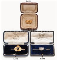 Lot 92 - A WHITE GOLD AND DIAMOND NAVAL SWEETHEART BAR...