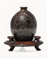 Lot 98 - AN EARLY 19TH-CENTURY CARVED COCONUT FLASK AND...