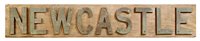 Lot 99 - A NAME BOARD FROM H.M.S. 'NEWCASTLE' (1937)