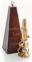 Lot 220 - A 19TH-CENTURY LACQUERED BRASS CULPEPER-TYPE...