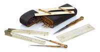 Lot 245 - Ø A BRASS AND IVORY DRAWING ETUI BY GEORGE...
