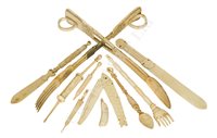 Lot 120 - AN EARLY 19TH CENTURY FRENCH NAPOLEONIC PRISONER-OF-WAR PAIR OF BONE SALAD SERVERS; and a quantity of other carved bone sailorwork