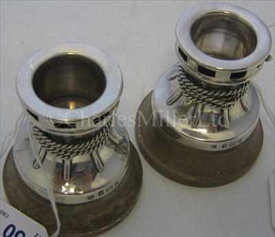 Lot 50 - A PAIR OF SILVER DWARF CANDLESTICKS <br/>modelled...