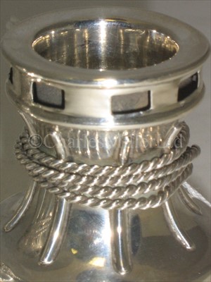 Lot 50 - A PAIR OF SILVER DWARF CANDLESTICKS <br/>modelled...