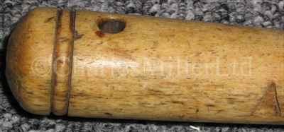 Lot 145 - A 19TH-CENTURY SCRIMSHAW-DECORATED HALF...